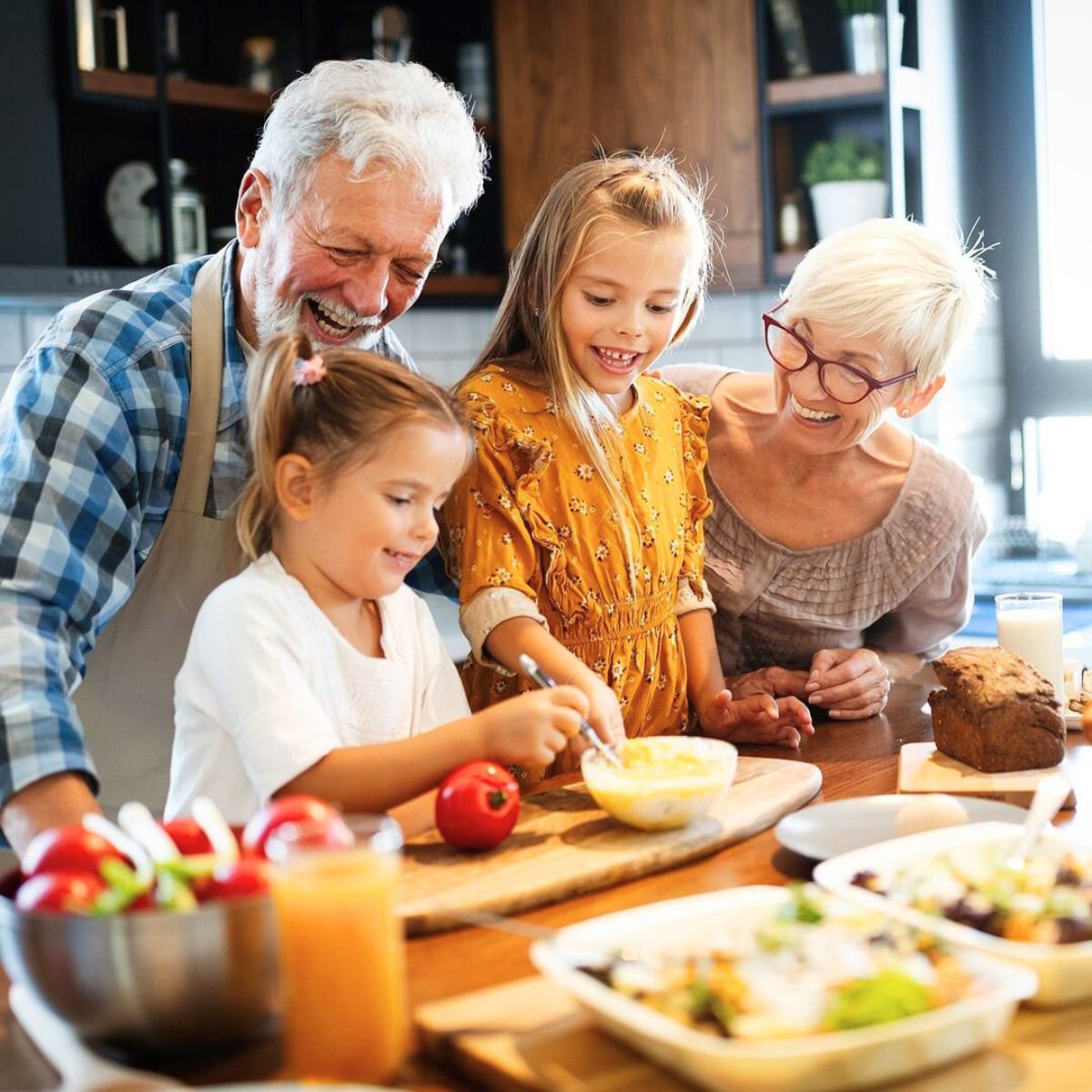 Grandparents cooking with their grandchildren