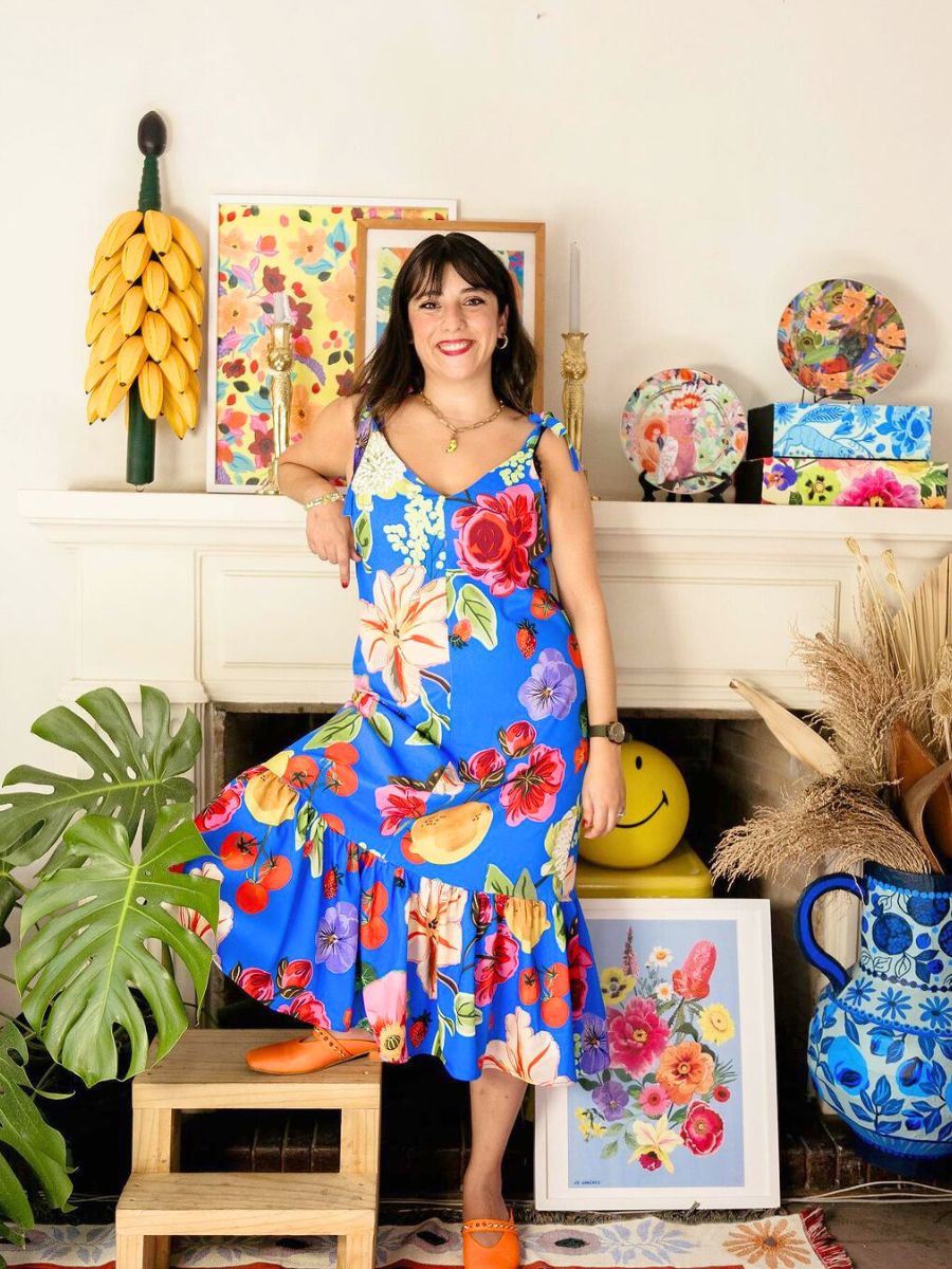 Jo Jimenez surrounded by her floral art