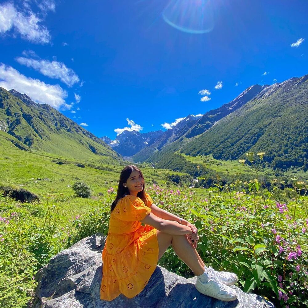 Girl Seating at flower valley of India