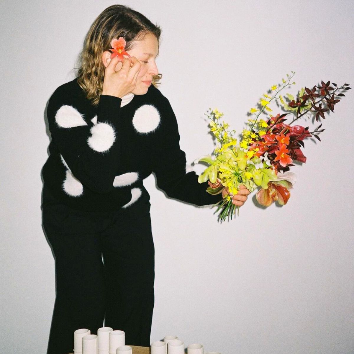 Elizaveta with a bouquet of colorful flowers