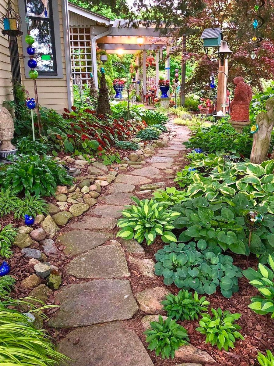 Green plants marking a shade garden entrance