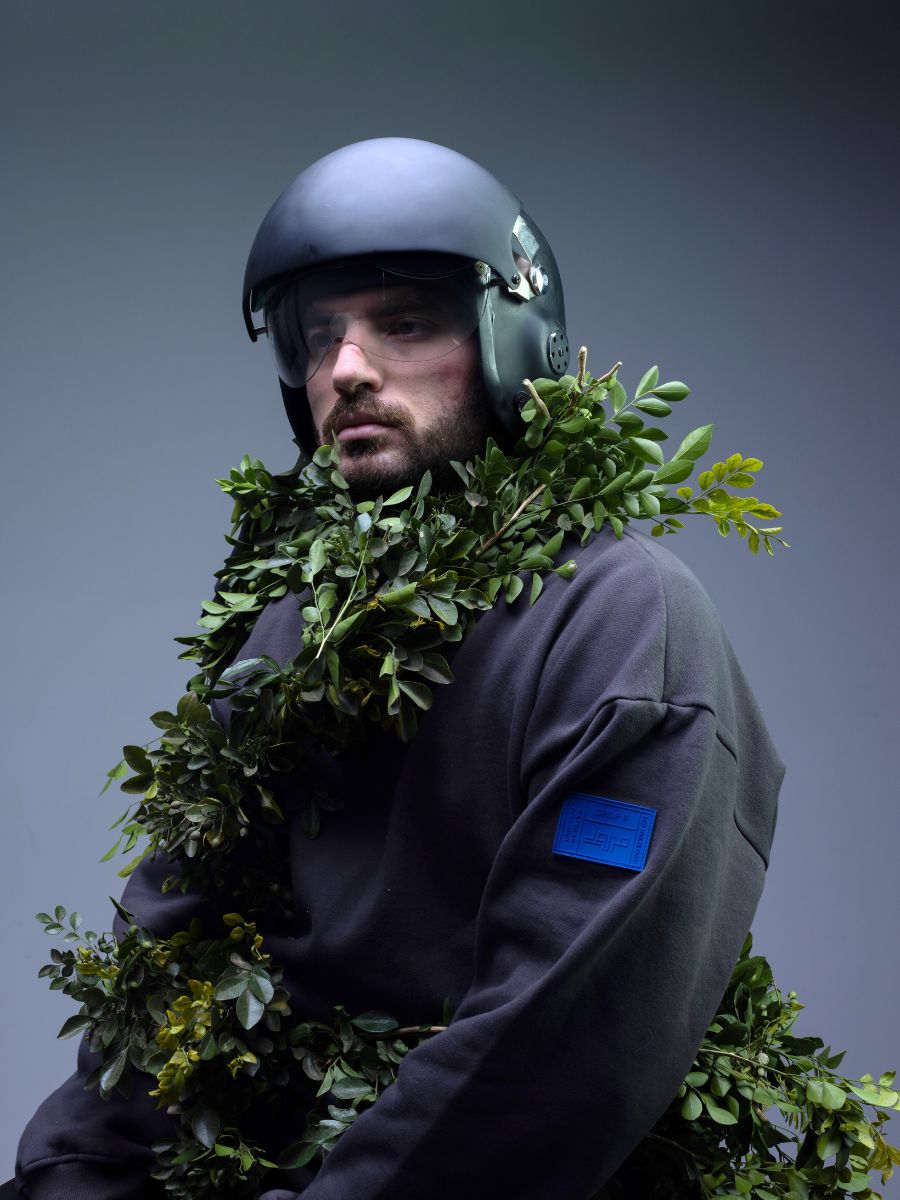 Abdulaziz with plants on clothes