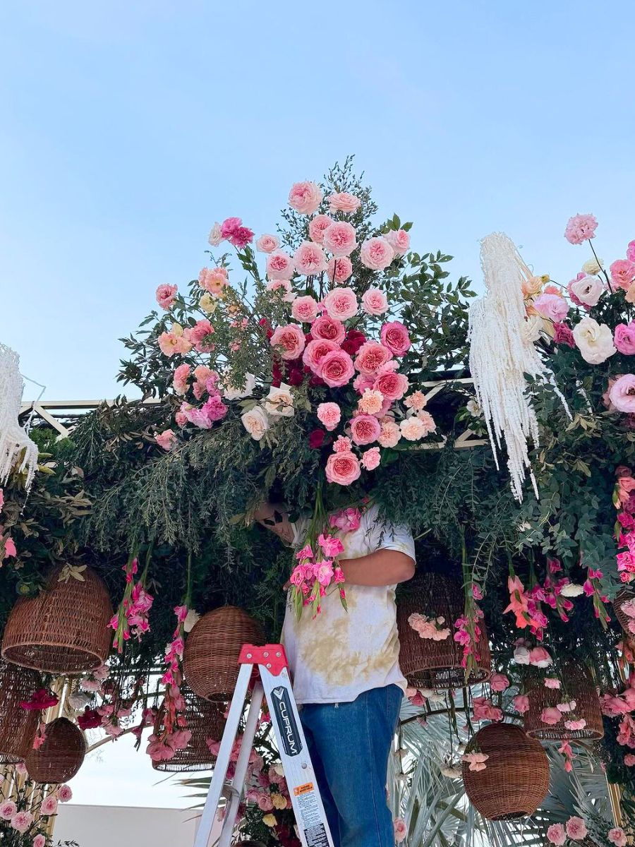 Setting up an event with pink flowers