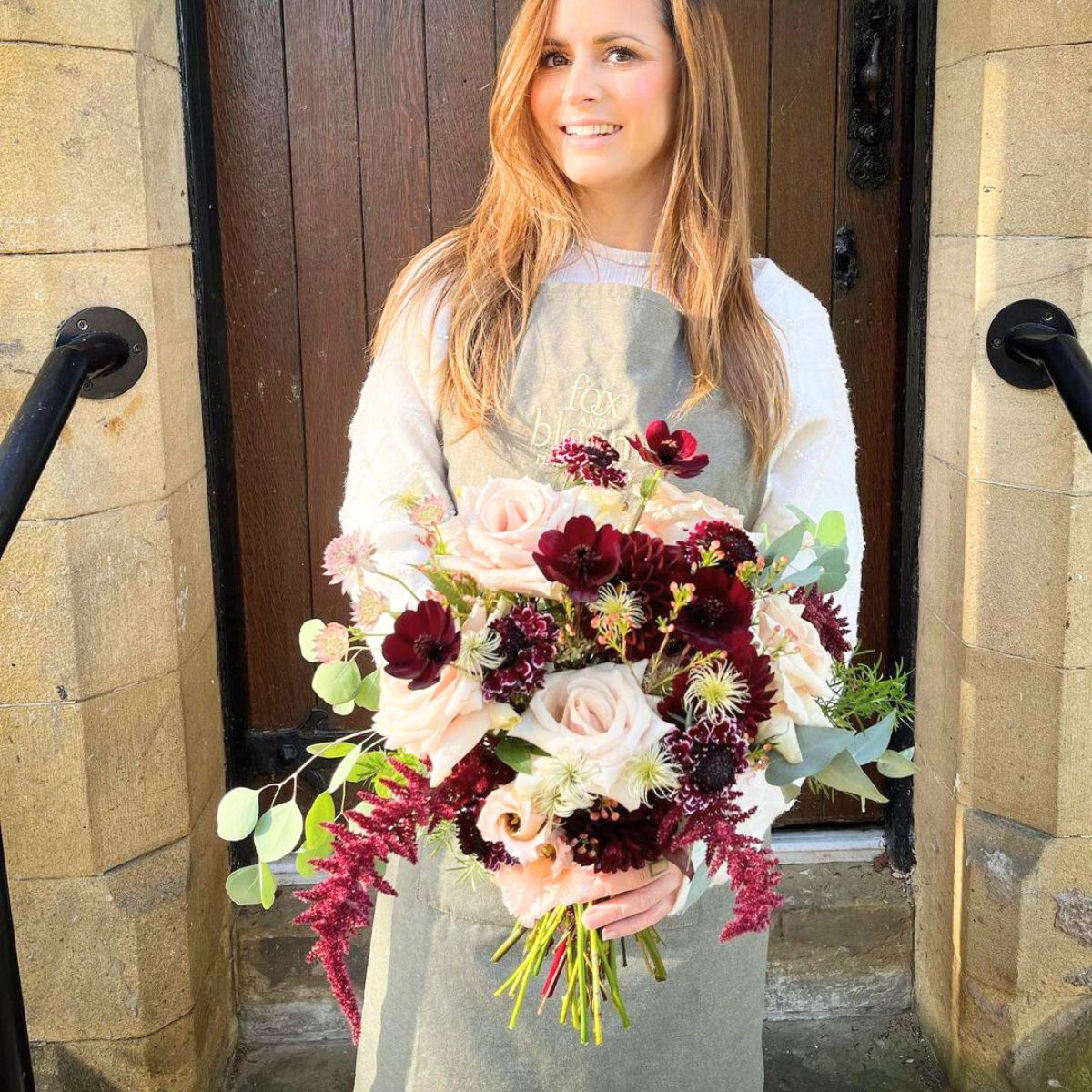 Sam Parker with a flower arrangement