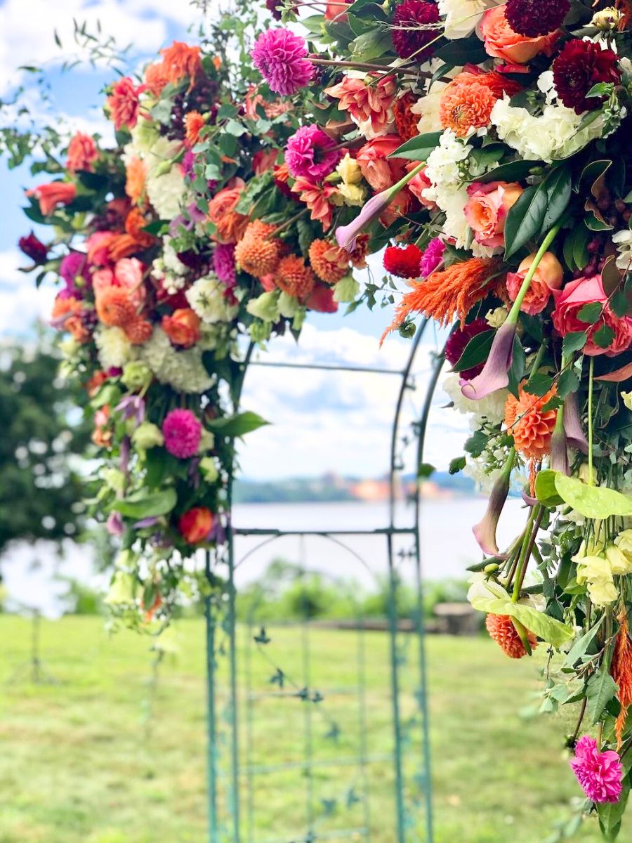 Callas dahlias and anthuriums for a wedding arch