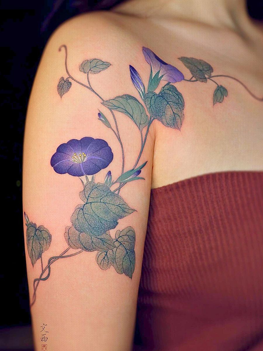 Morning glory tattoo with its striking heart-shaped leaves