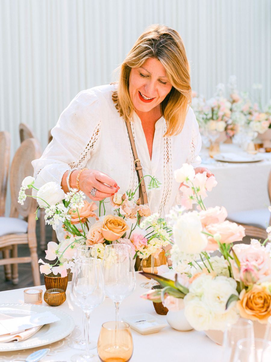 Paula arranging flowers at an event