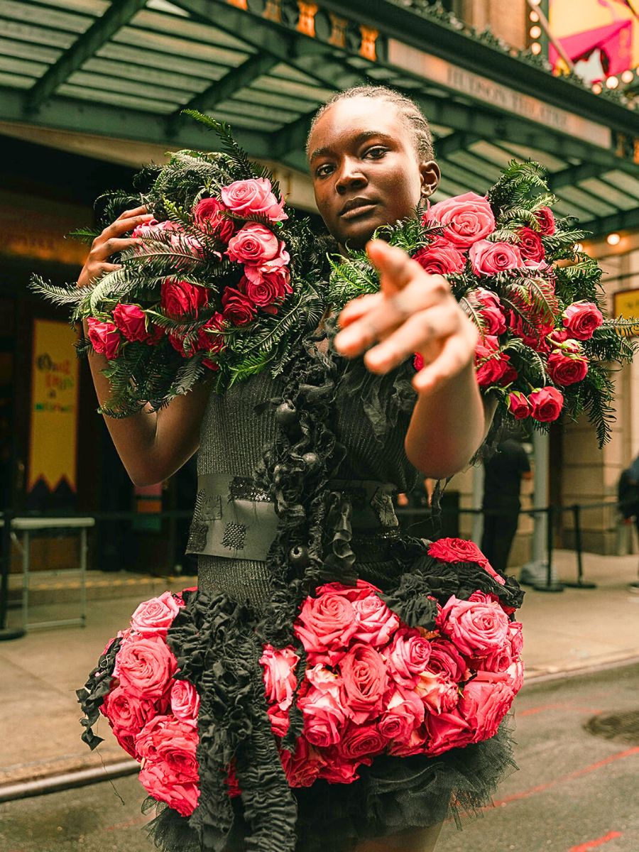 Model with red roses by Julia Rose couture