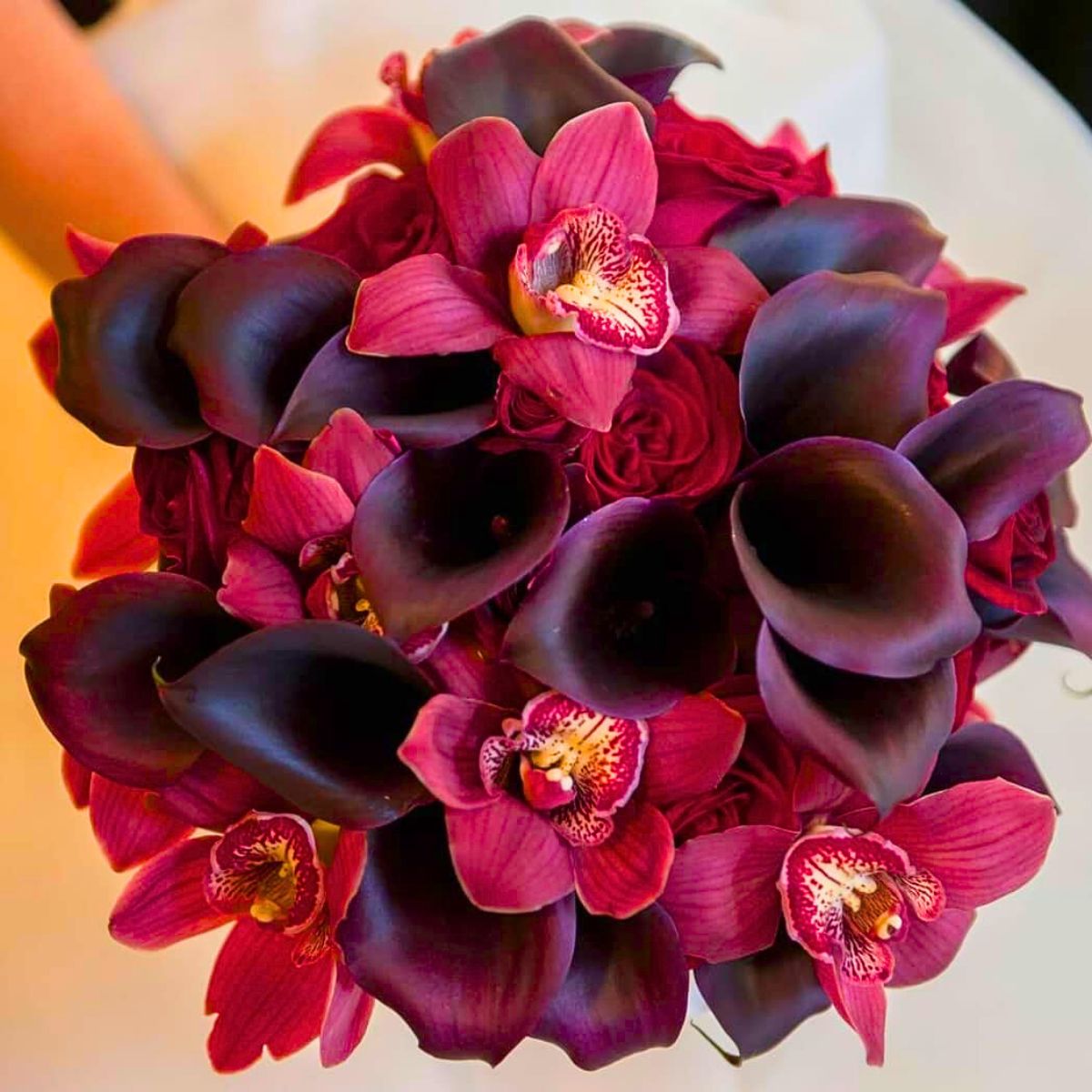 Burgundy calla and orchid bouquet