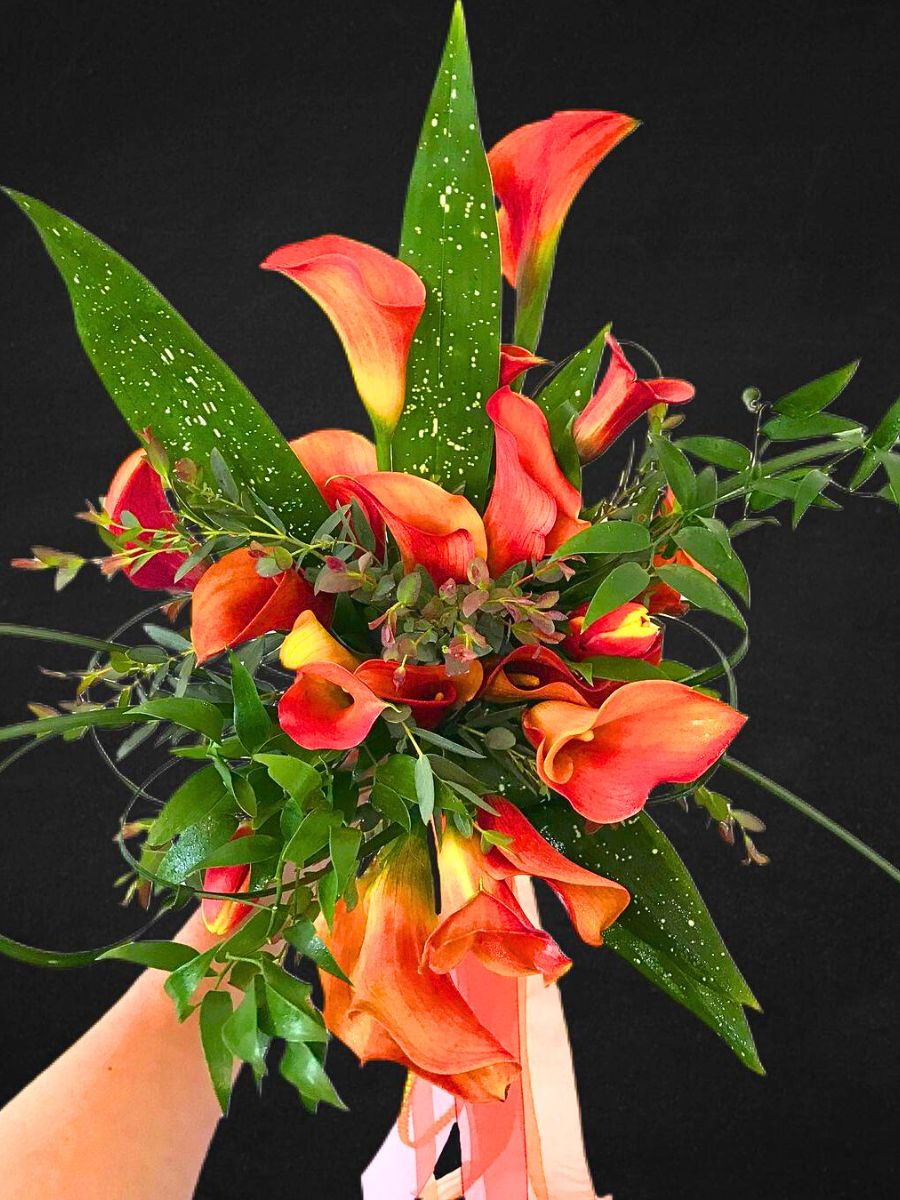 The perfect orange calla bouquet with greenery