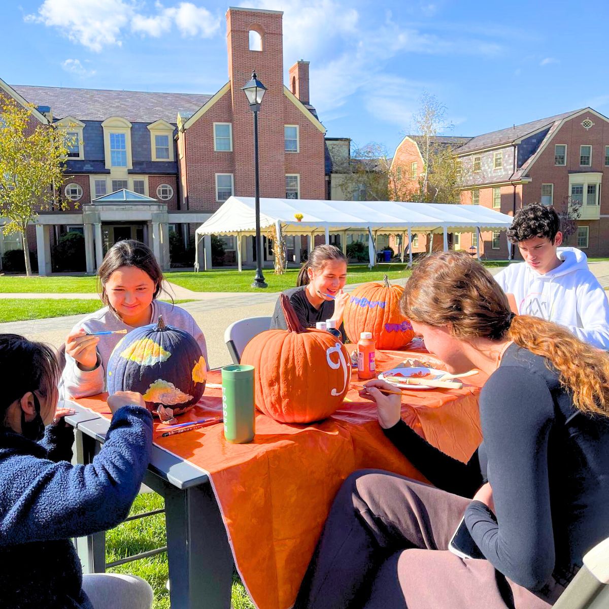 Children painting pumpkins