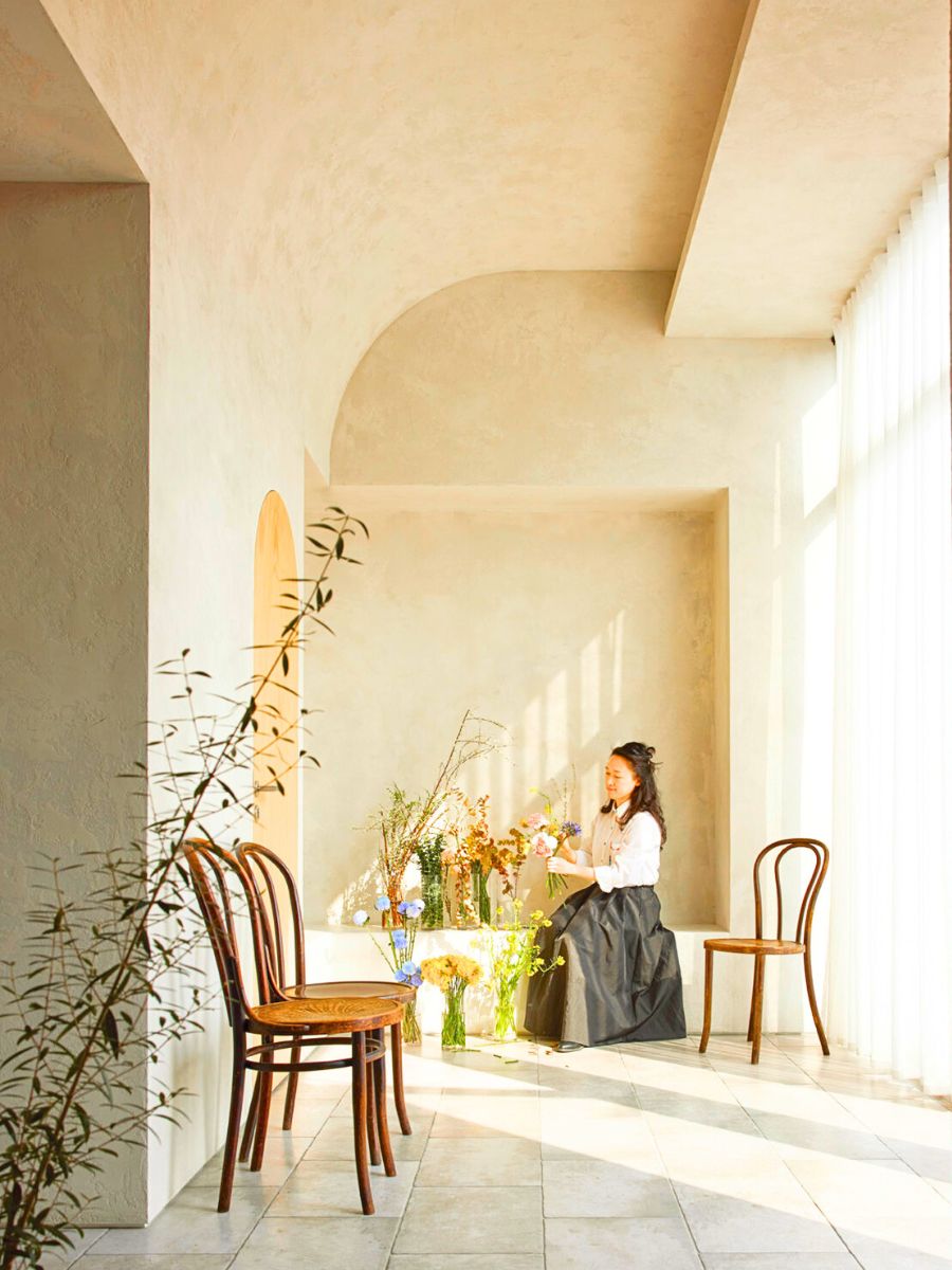 Jung in an aesthetic house space with flowers