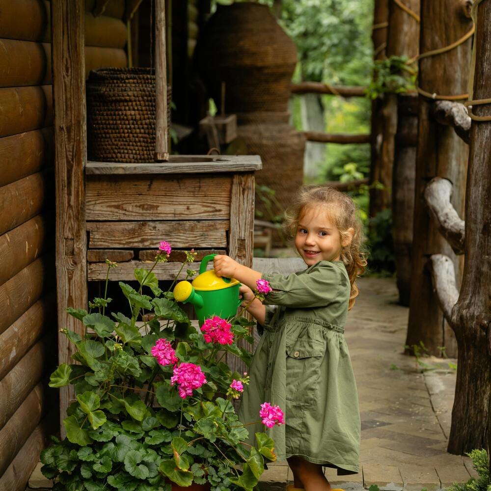 Children playing around house plant