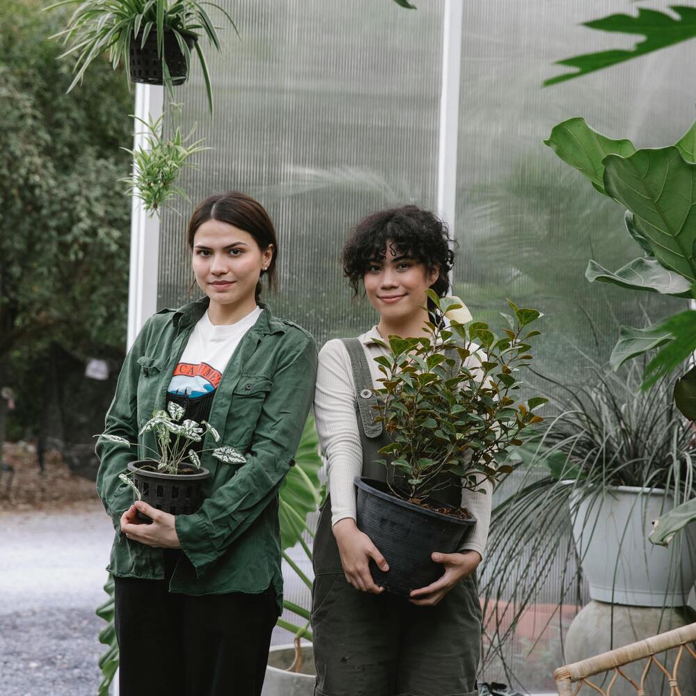 lady holding plant for gardening