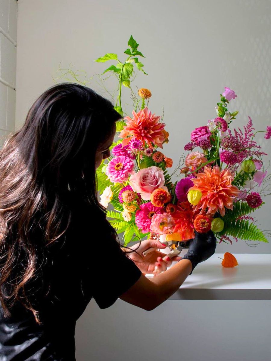 Laurie Riley working on a floral design