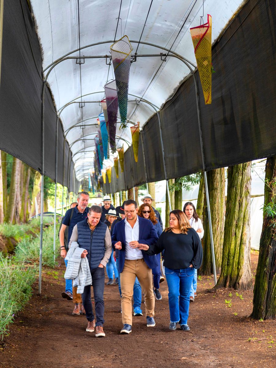 Visitors walking through the Rosaprima farm