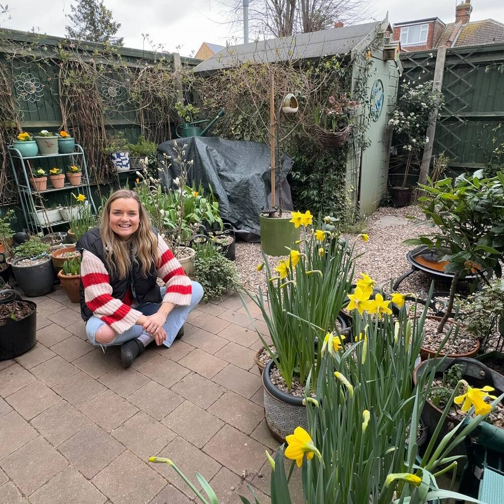 Lady with urban garden flowers