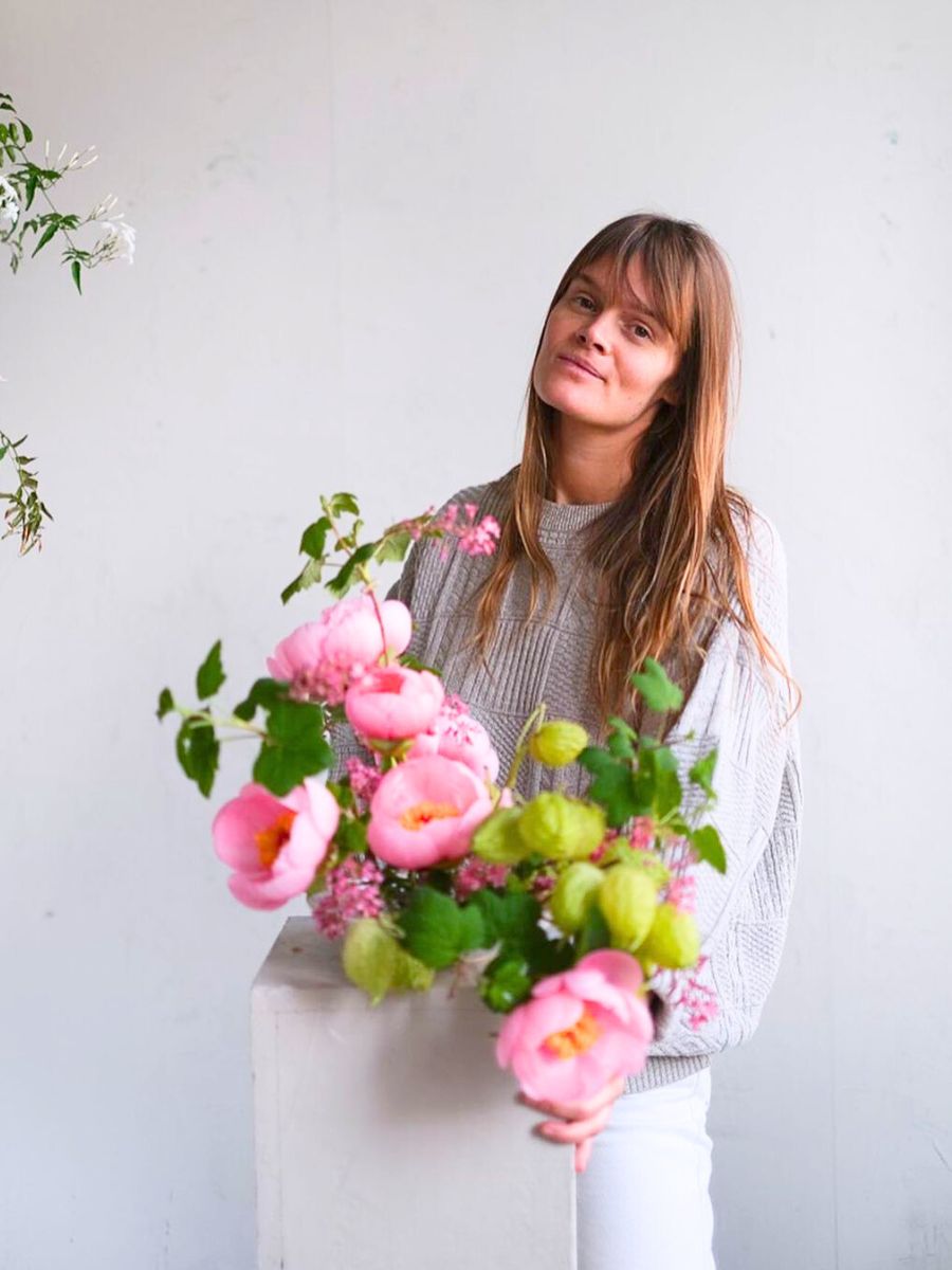 Leone with a pink Ikebana arrangement