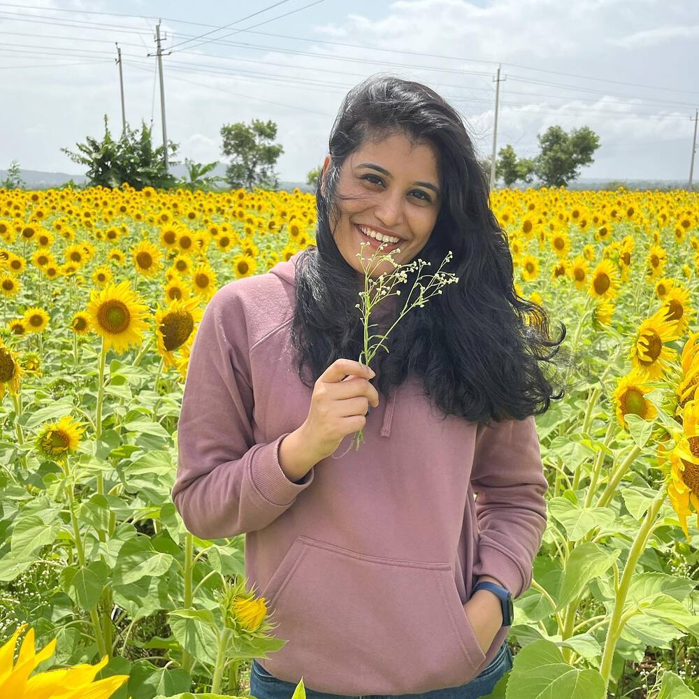 Lady standing in flower field