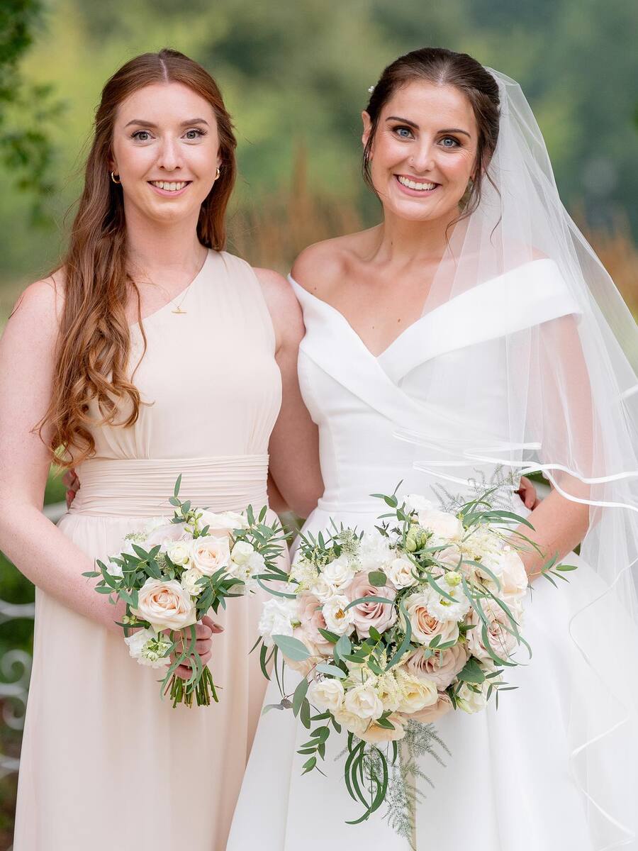 Friend and Bride with flowers bouquet