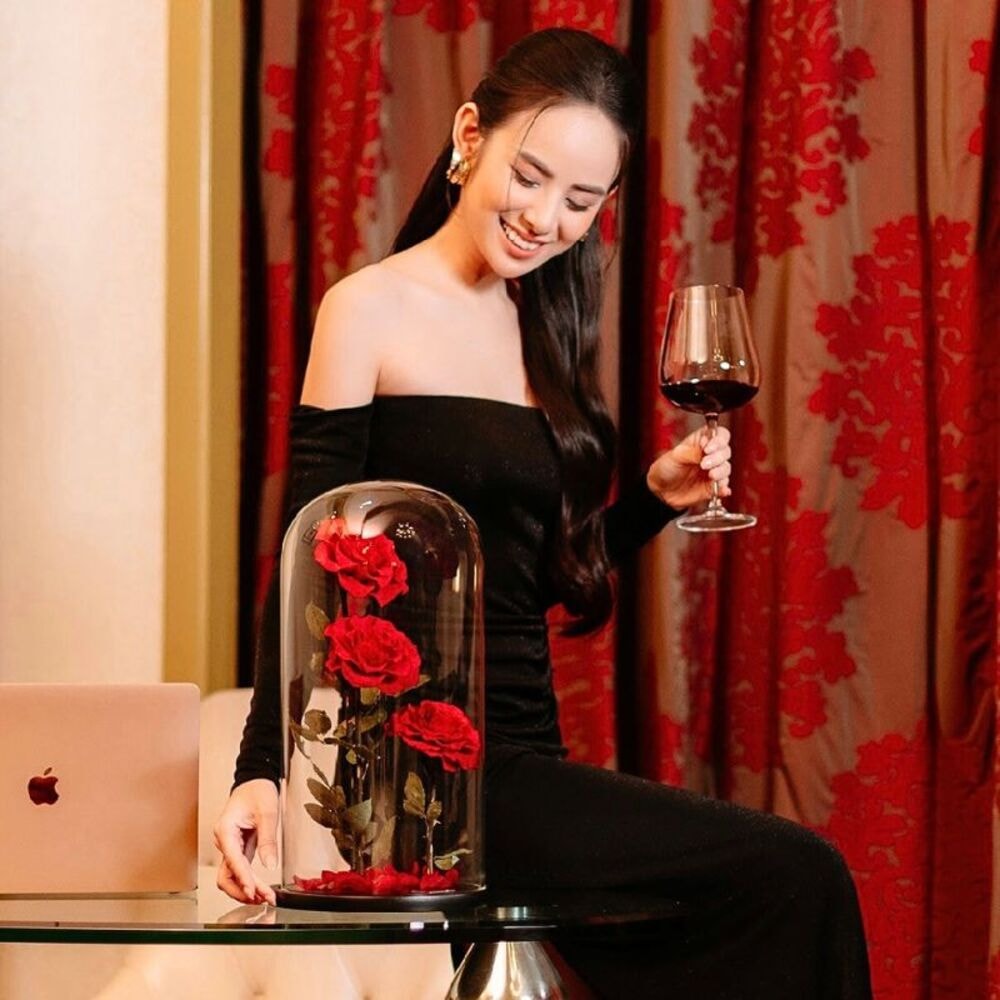 beautiful preserved red roses kept on a desk