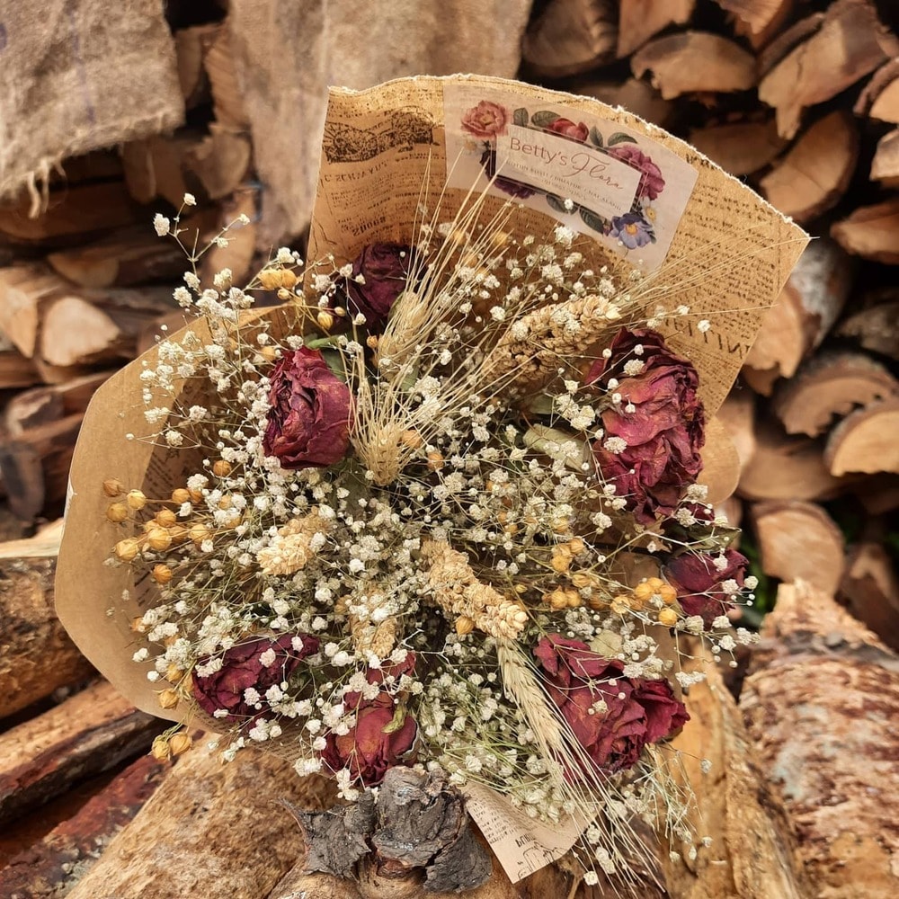 a bouquet made of preserved roses and flowers