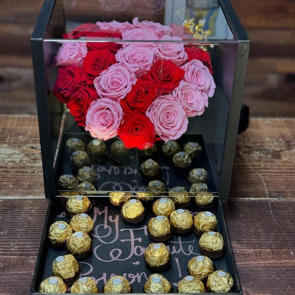 red and pink preserved roses presented as a gift