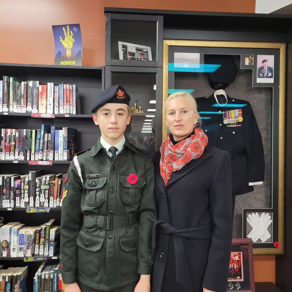 a kid dressed as veteran with a poppy brouch on Remembrance Day