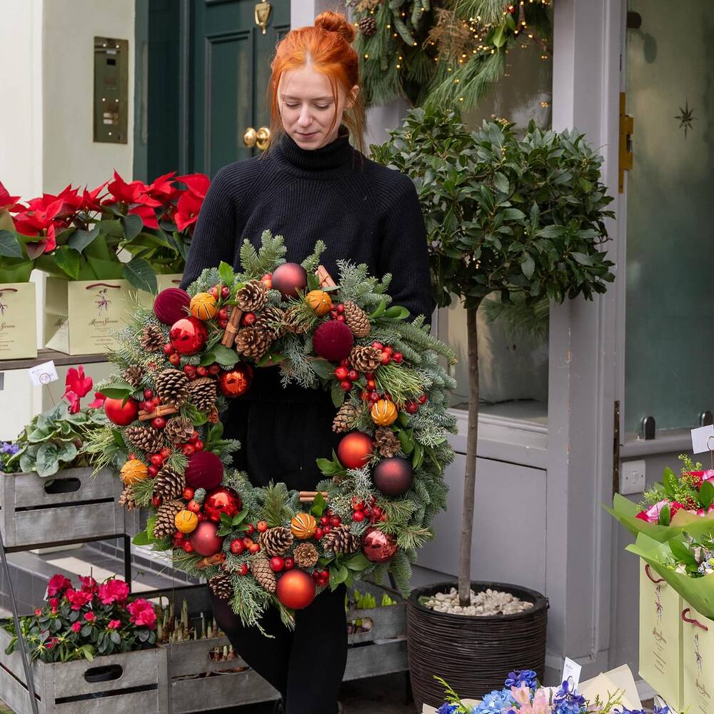 lady with flower ring at flower shop