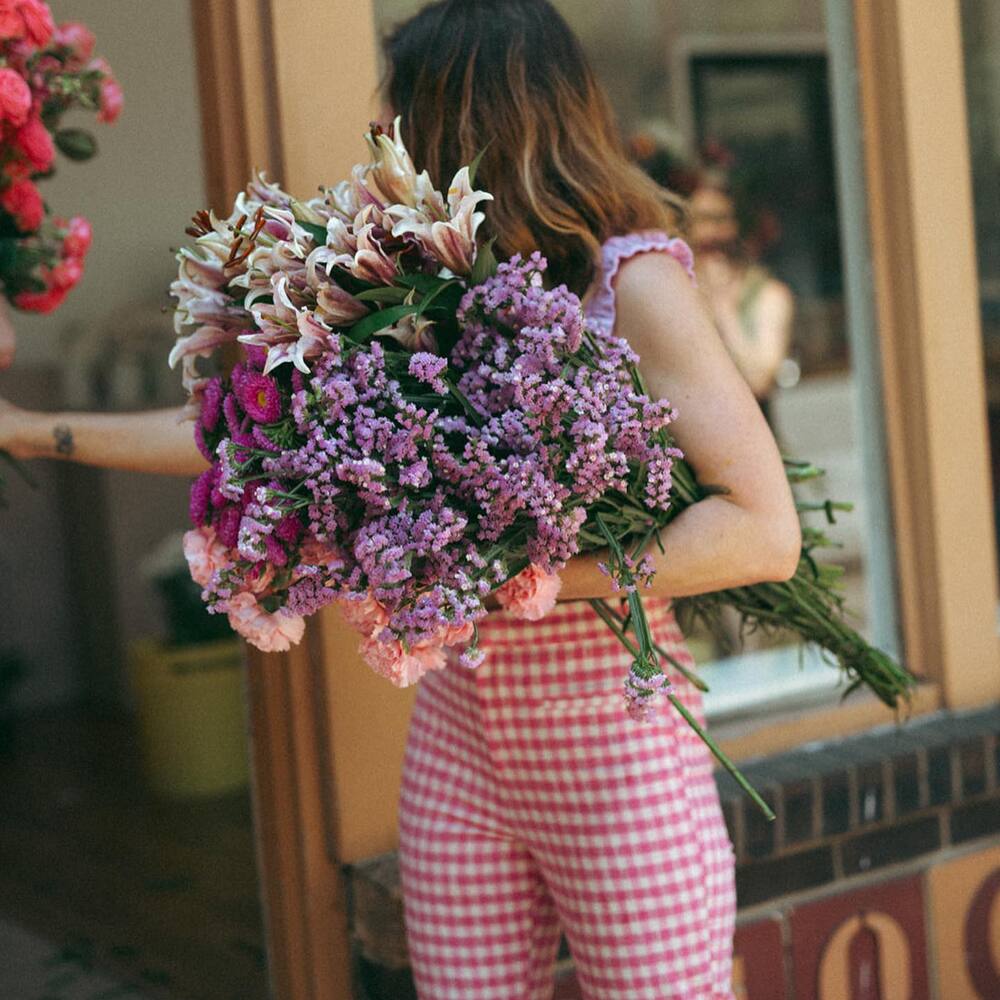 Lady purchasing flower bouquet