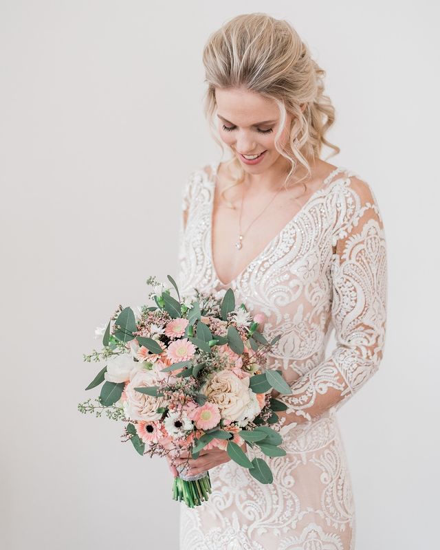 bride holding beautiful bouquet of gerberas by gerberas united