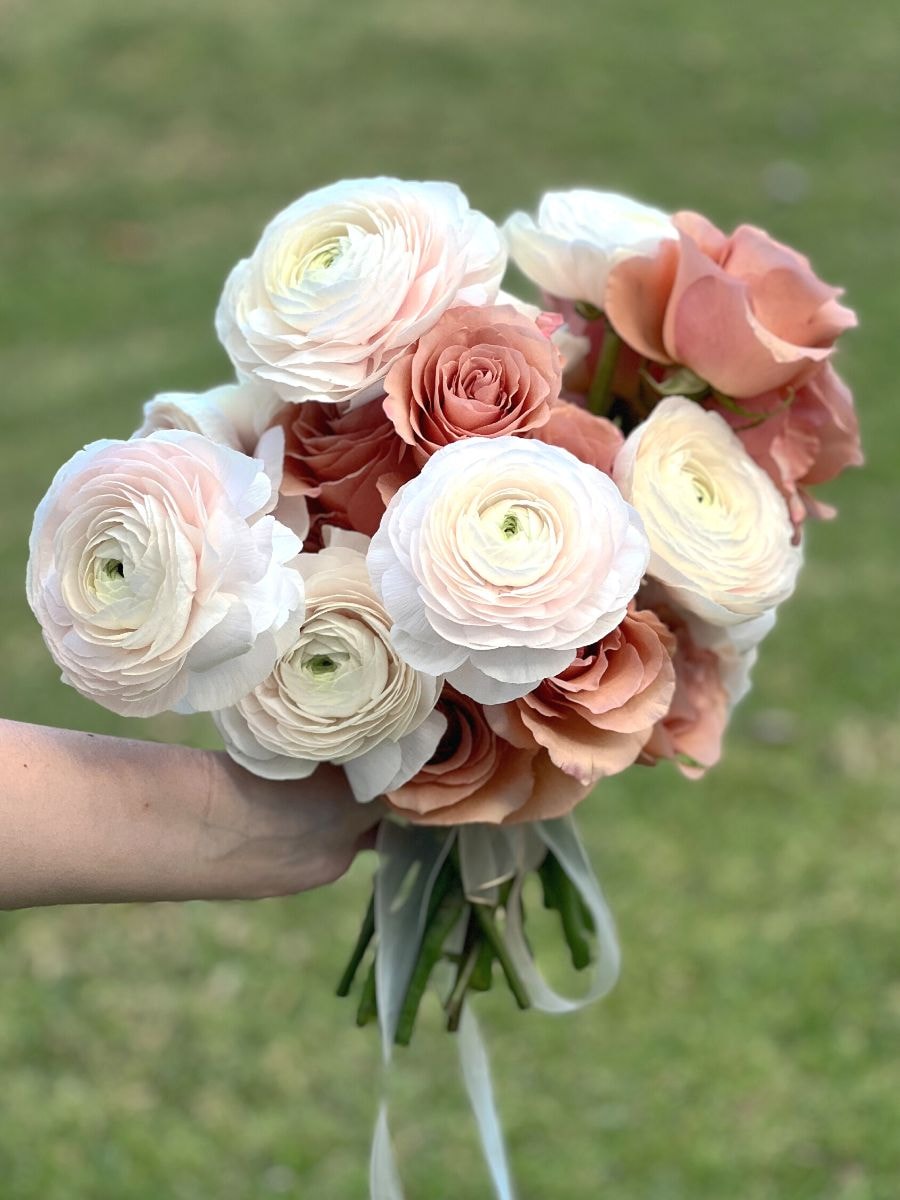 a wedding bouquet arrangement of ranunculus