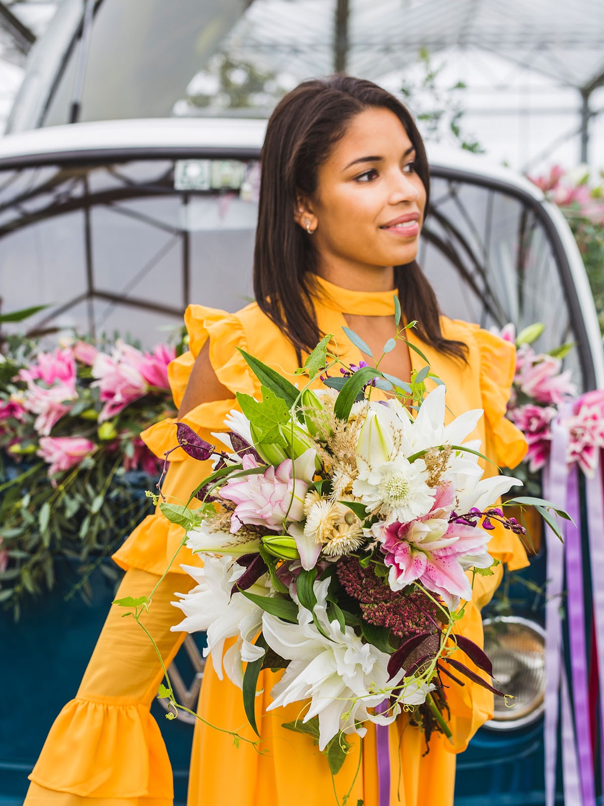 woman holding bouquet of roselilies