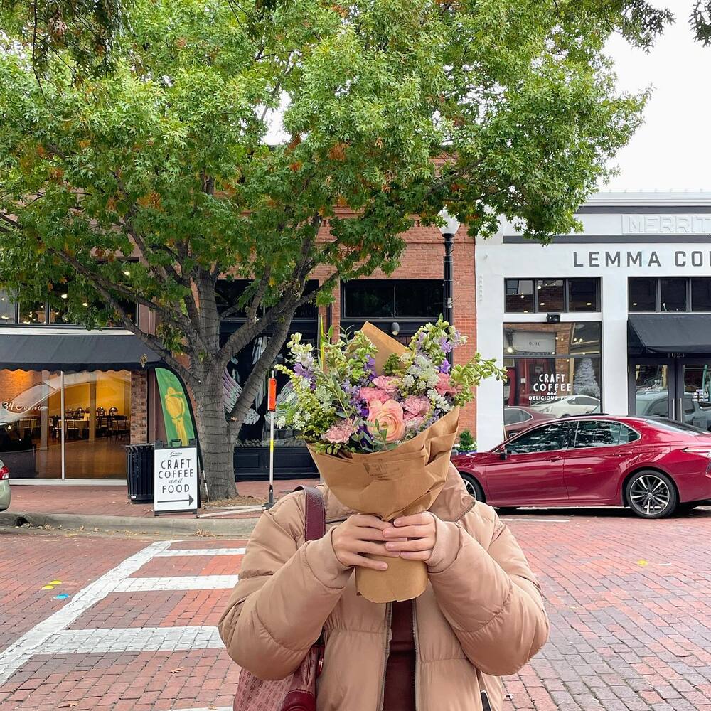 lady with lil flower bouquet