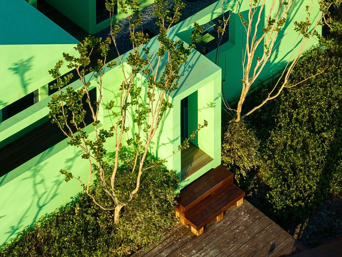 Nature surrounds the pastel green walls