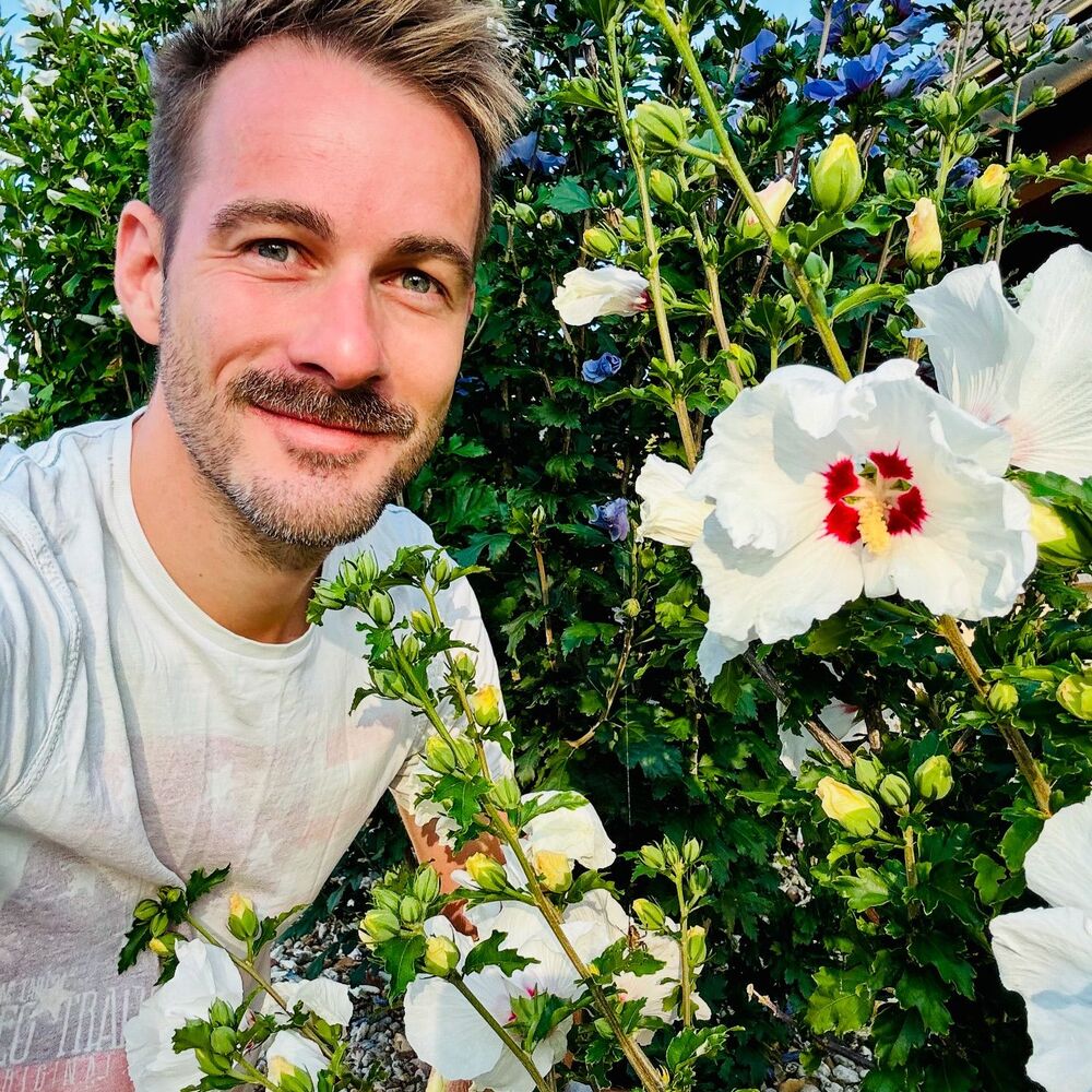 Men with urban garden flowers