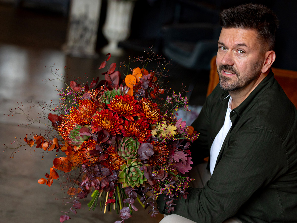 Krisztian Kover with orange fall bouquet