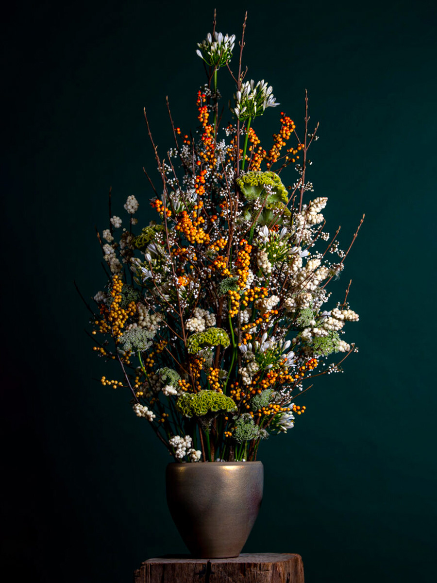 Ilex floral arrangement with Agapanthus Radical Wonders