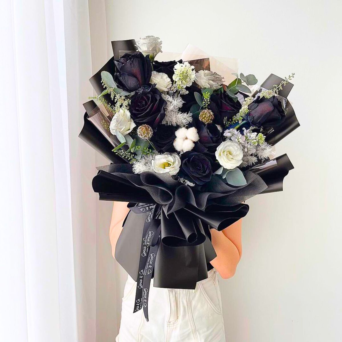 Gorgeous combination of whites flowers and black roses