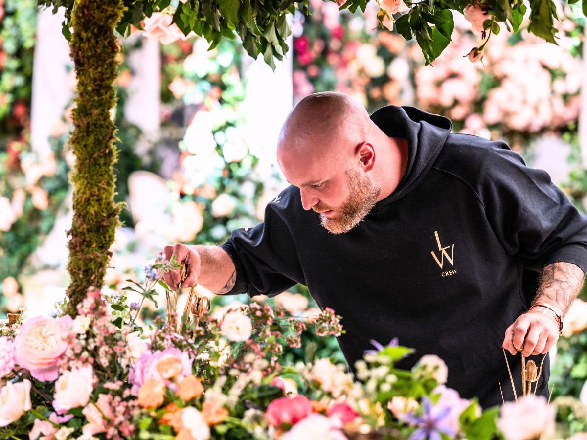 Larry Walshe working on a floral design