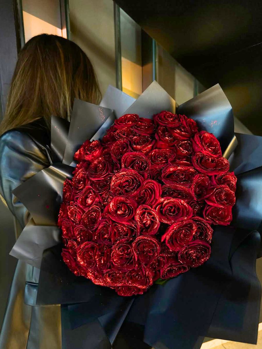 A huge bouquet of red glitter roses for a gift