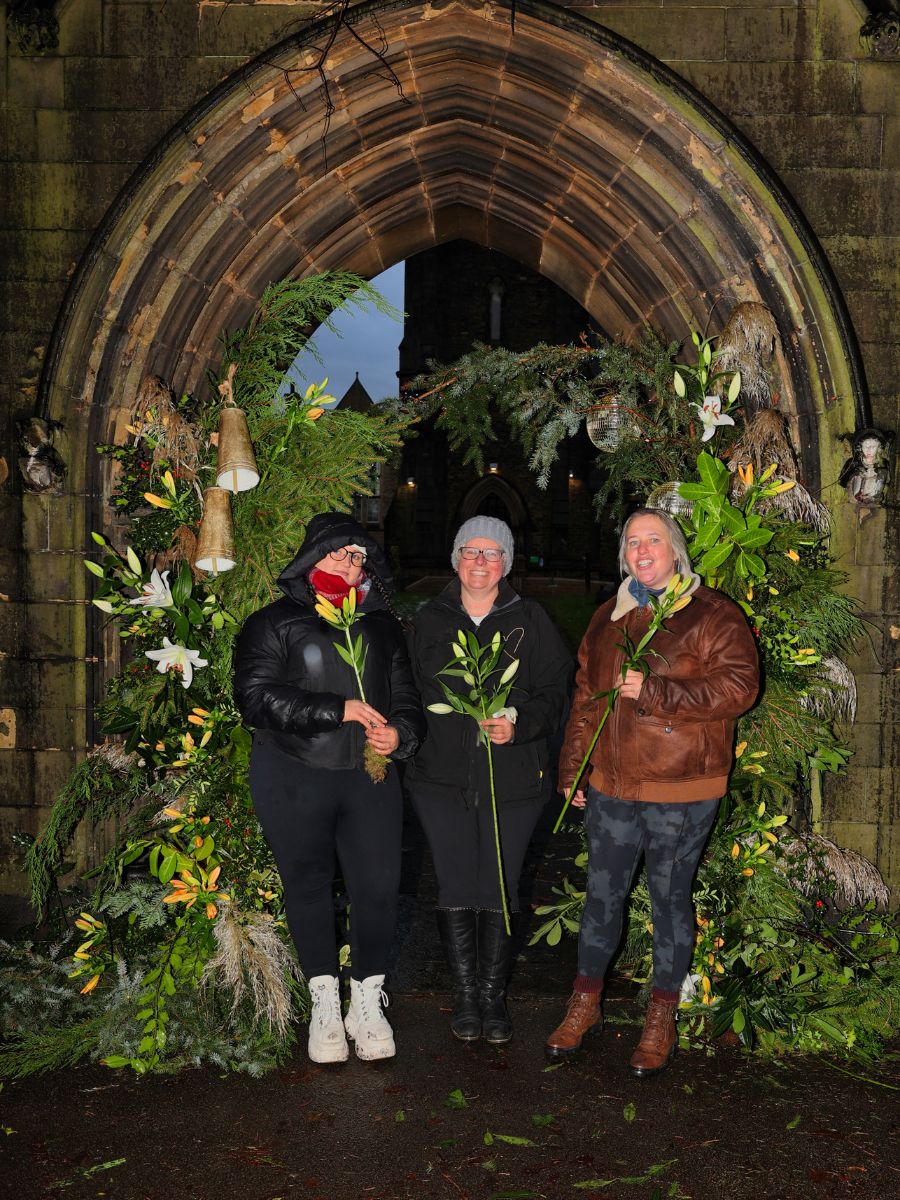 Jacqui O BFF Bredefleur Friend With Her Volunteers and Her Christmas Arch Made in Stormy Weather