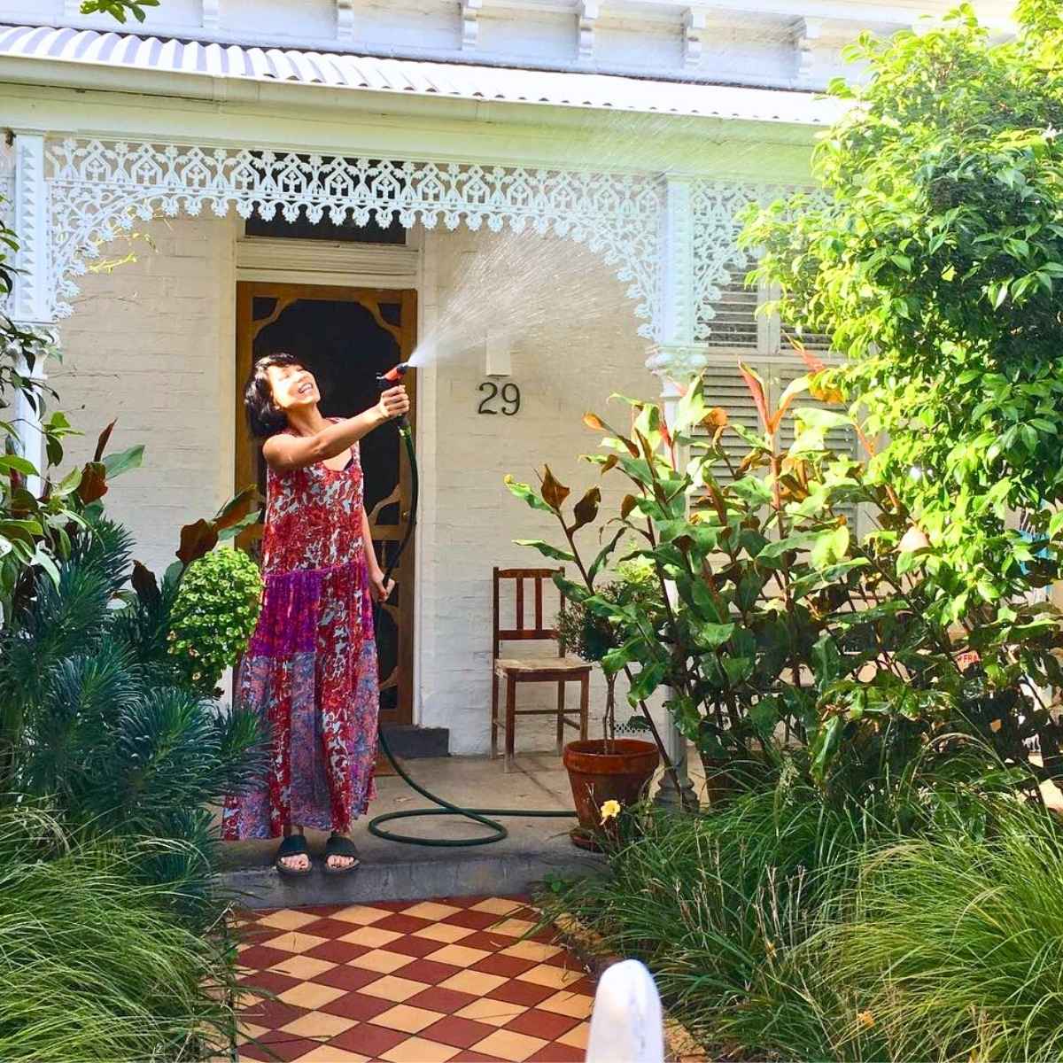 Woman watering her garden