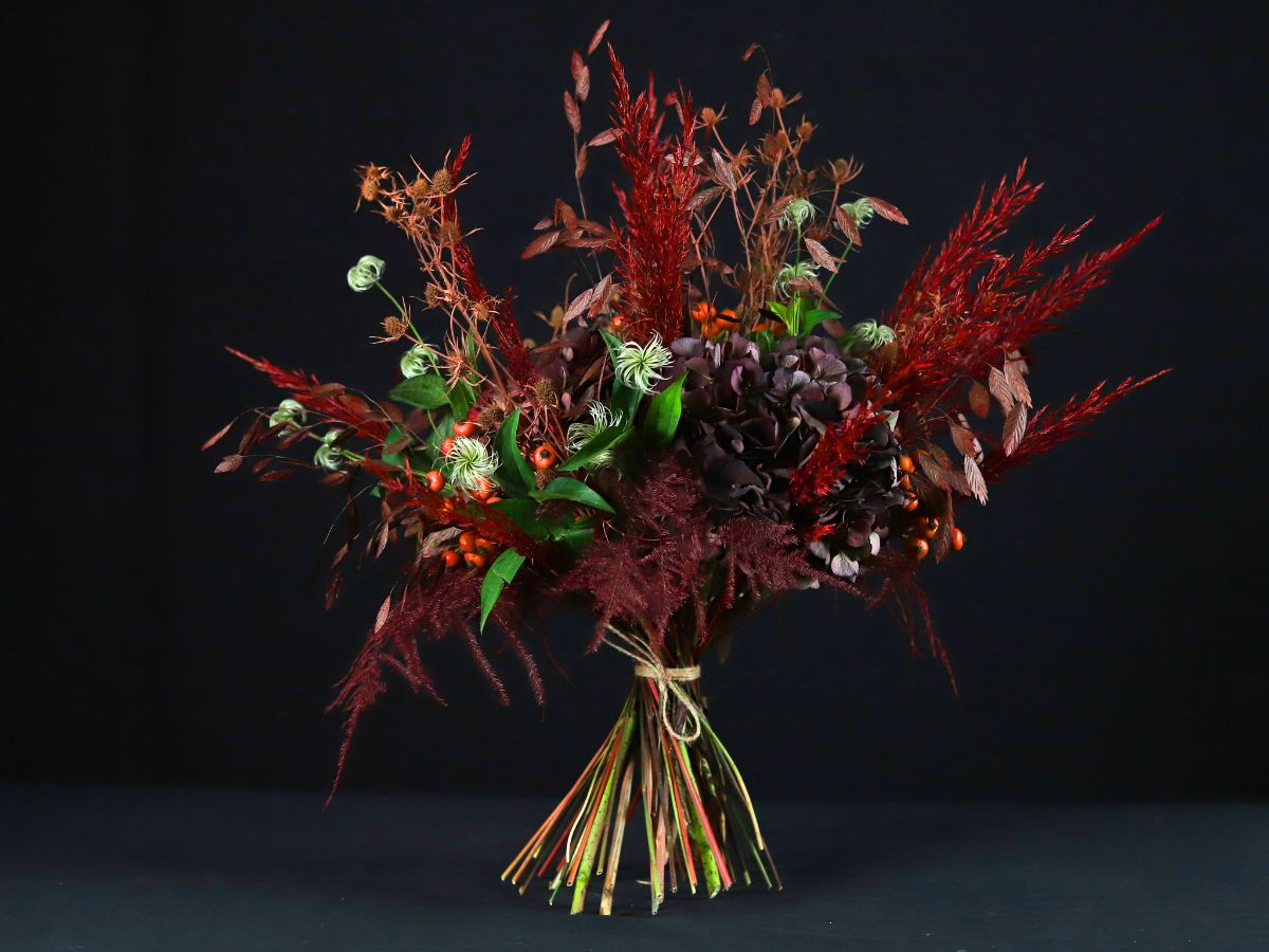 Dark toned hydrangeas in an arrangement by Gaetan Jacquet