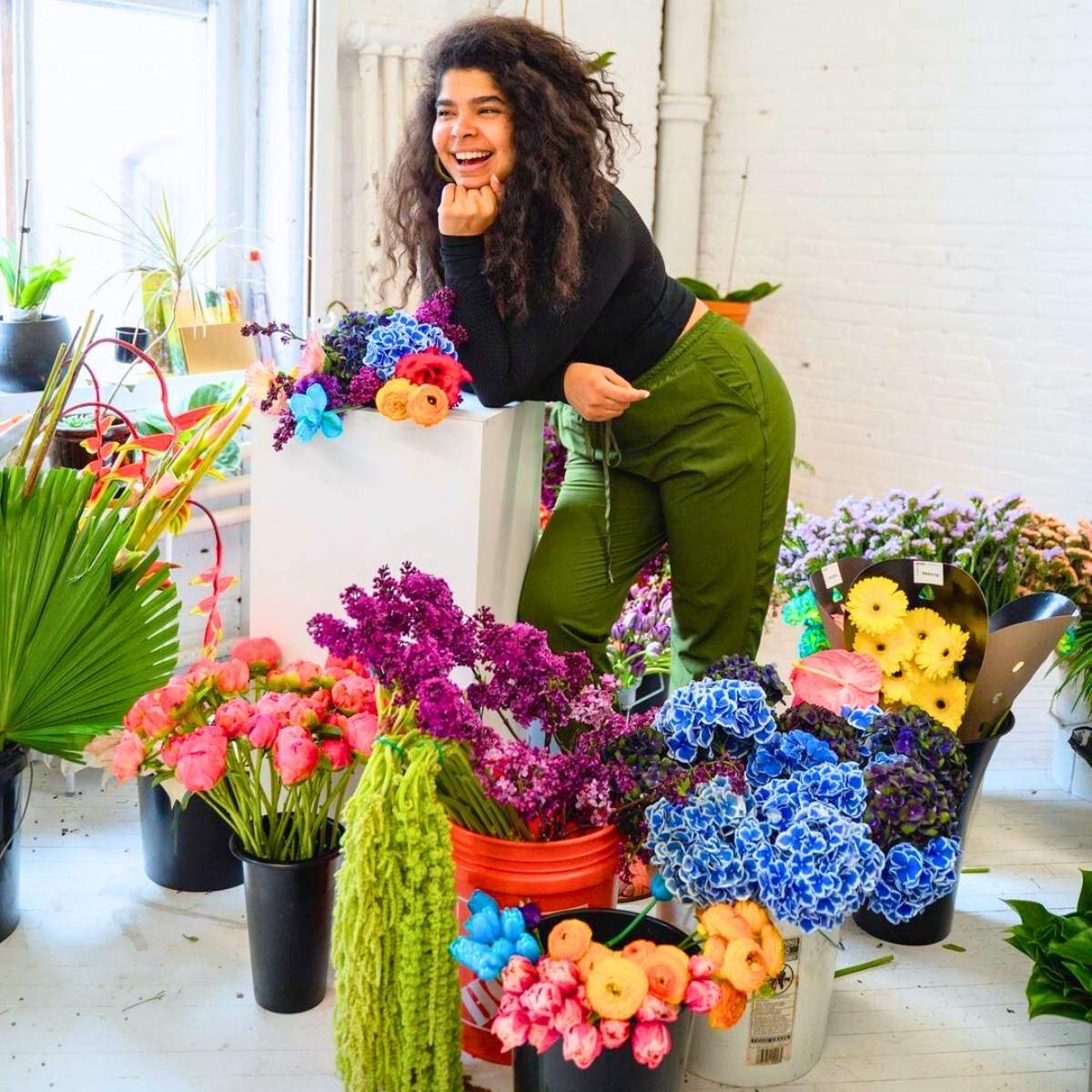 Emily Scott surrounded by flowers