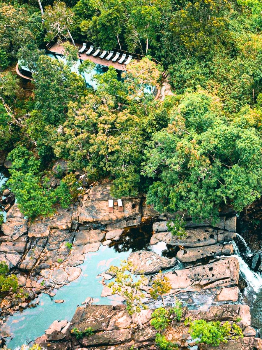 View of Shinta Mani Wild hotel next to waterfalls