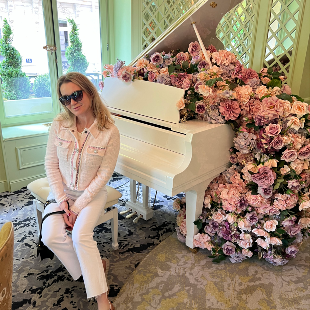 lady seating next to rose decoration