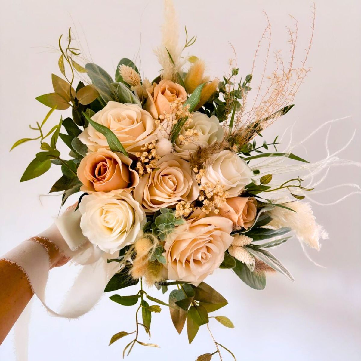 A neutral peachy wedding bouquet