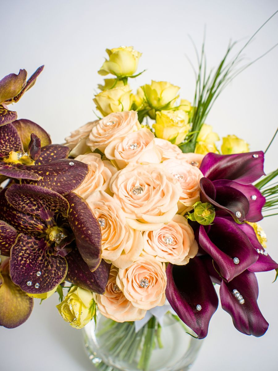 Orchids spray roses and callas with diamonds