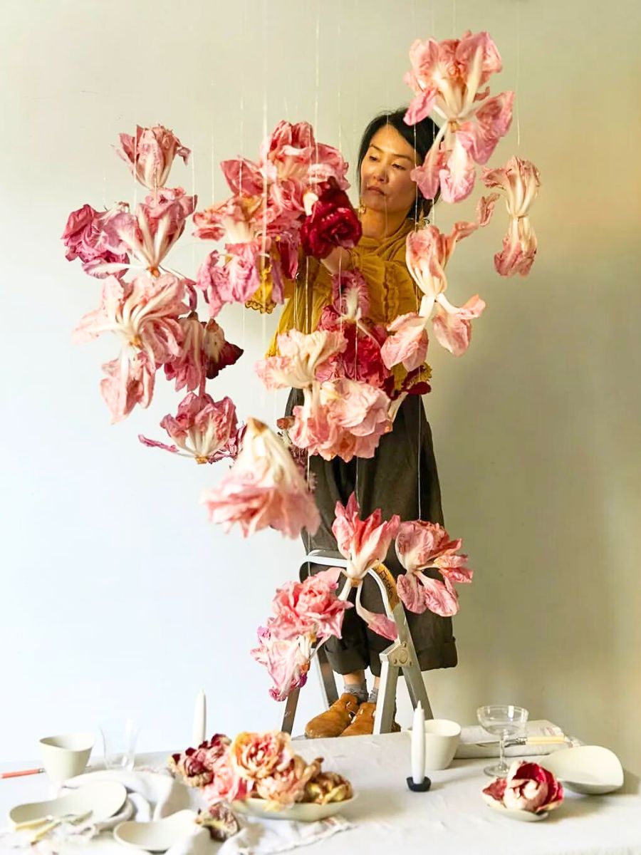 Frida Kim hanging flowers